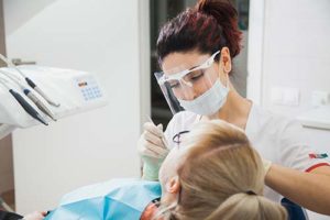 woman getting cosmetic dentistry services in West U texas