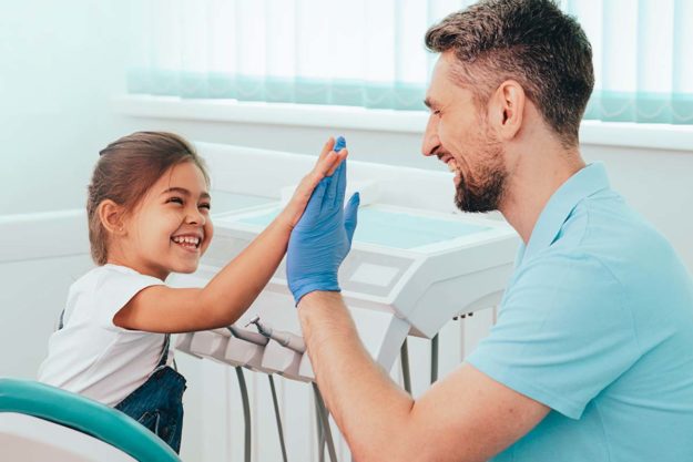 How to Choose a Pediatric Dental Office (4) father and daughter after finding a pediatric dental office